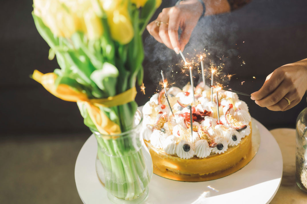 Cake being lit with candles