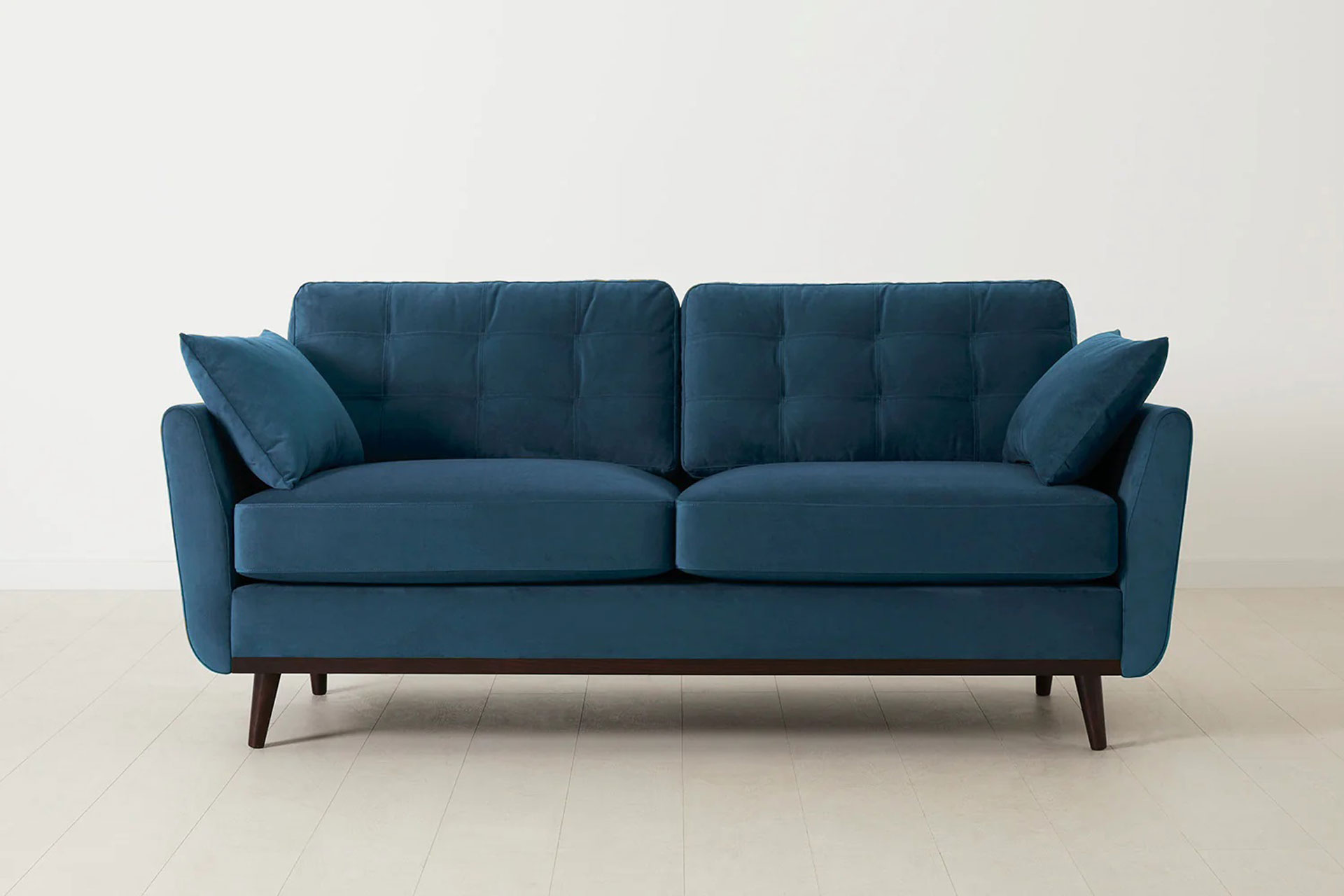 Royal blue two-seater sofa.