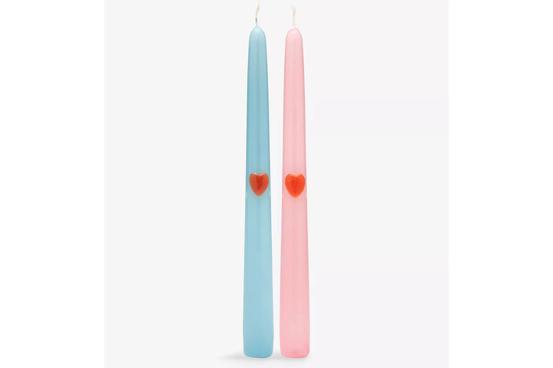 Blue and pink tapered candles with red hearts on