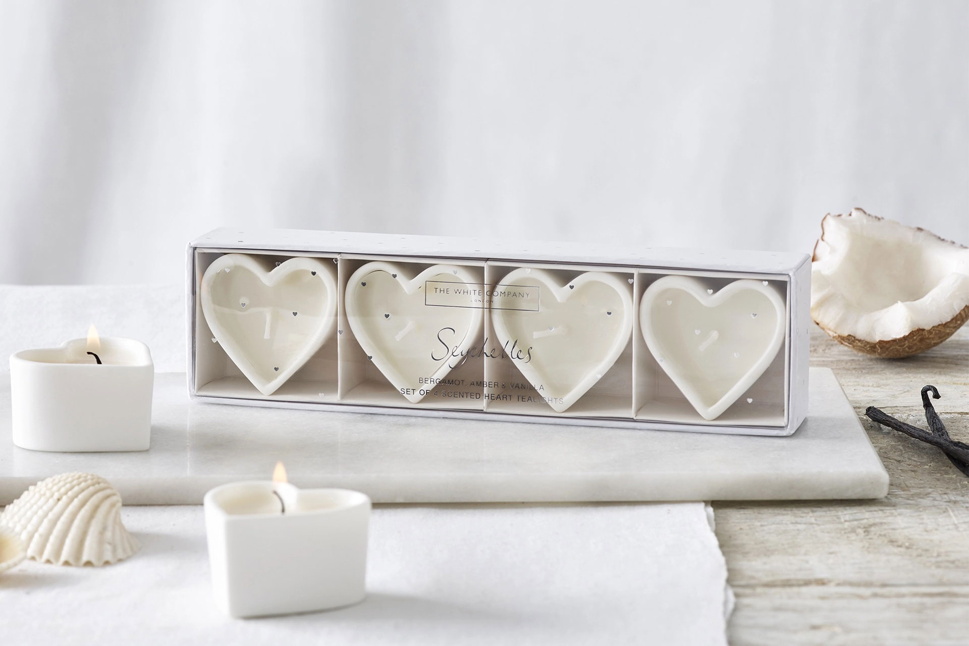 Box of white heart-shaped tealights