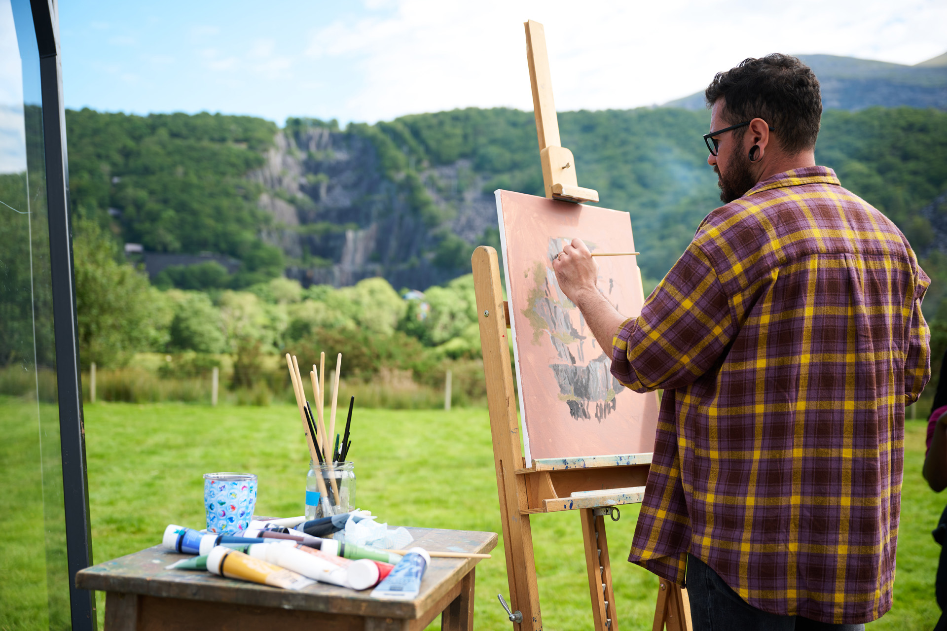 A man painting a landscape