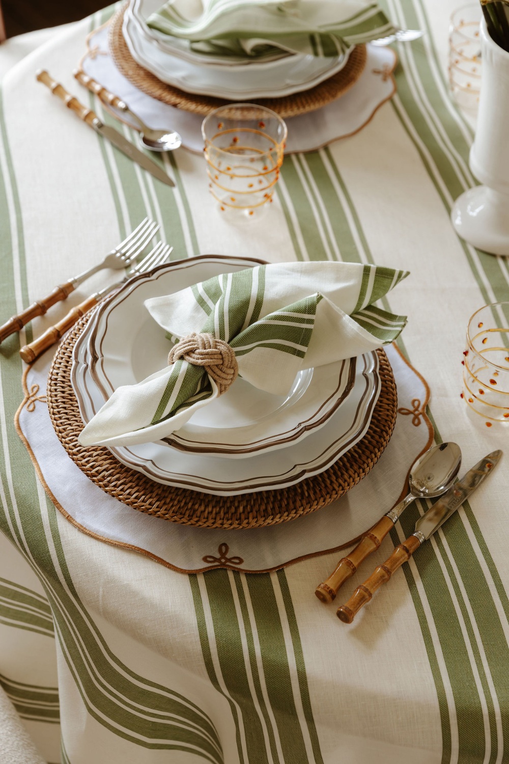 Table set with green stripe linens