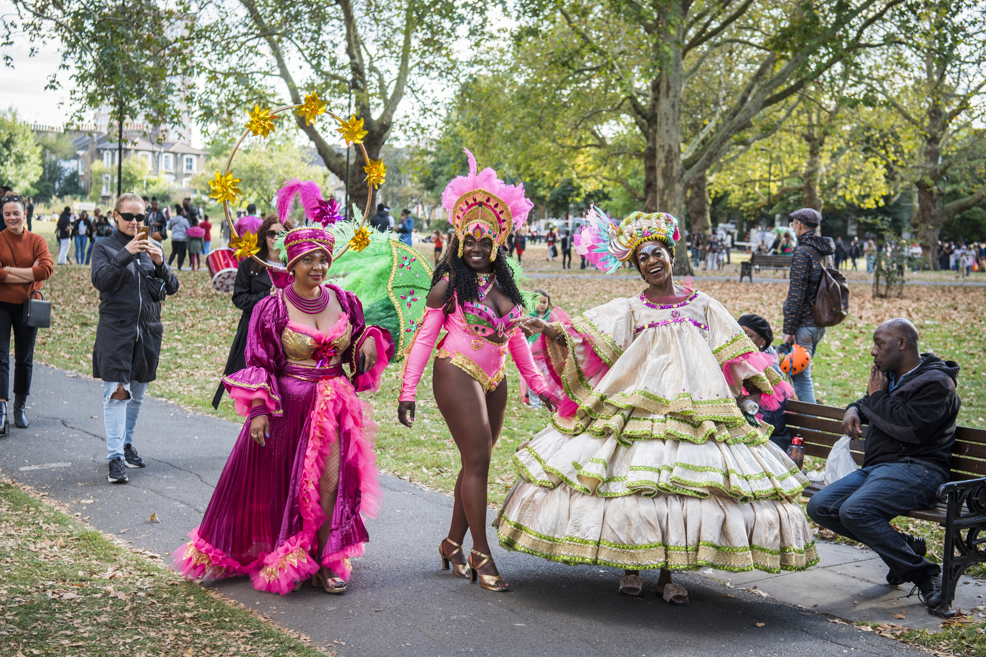 Three women dressed in extravagant costumes at Hackney Carnival