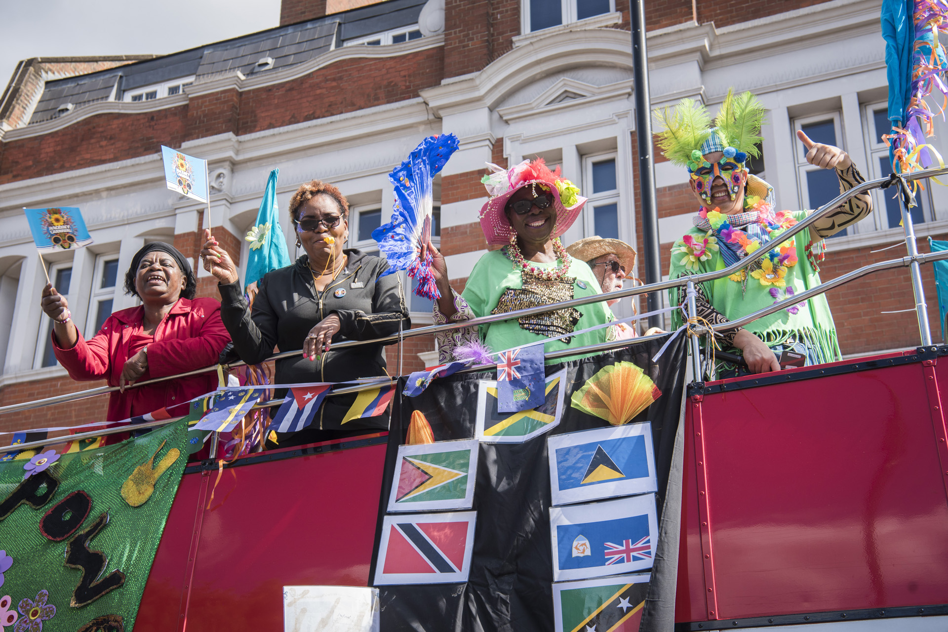 Women looking down from a parade float