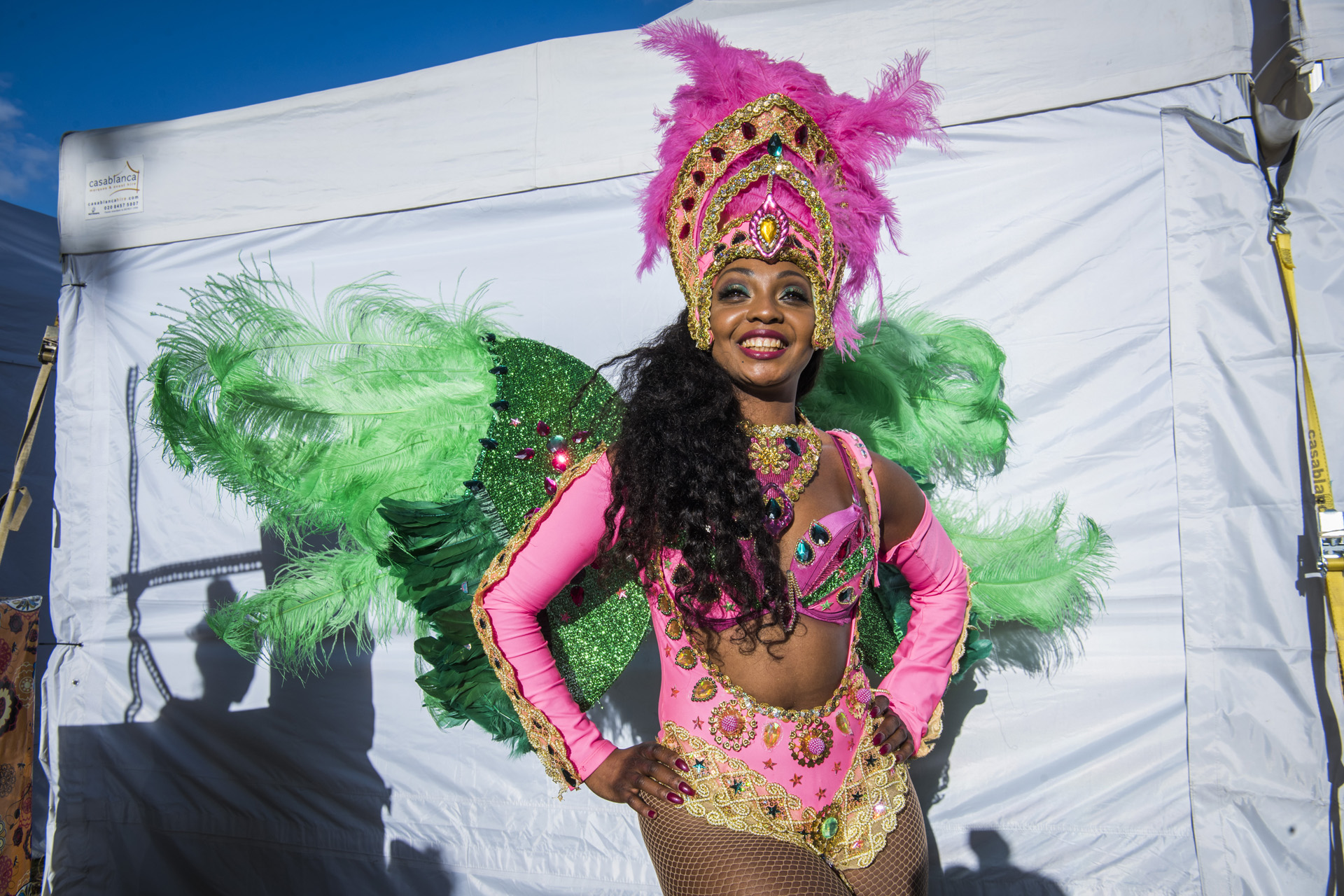 A woman in a pink carnival costume