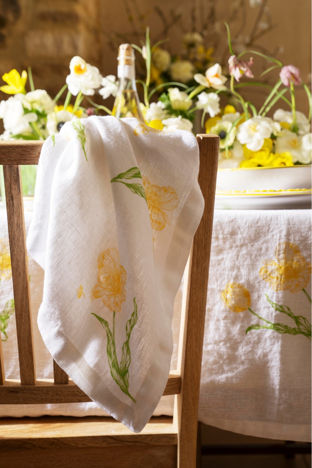 Back of chair with daffodil napkin