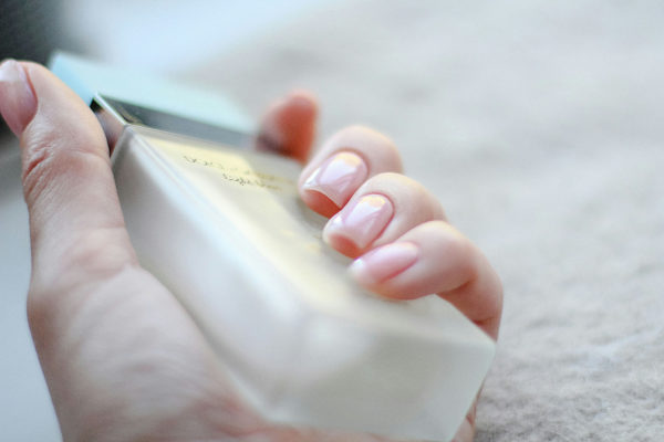 Hand with BB nails holding bottle