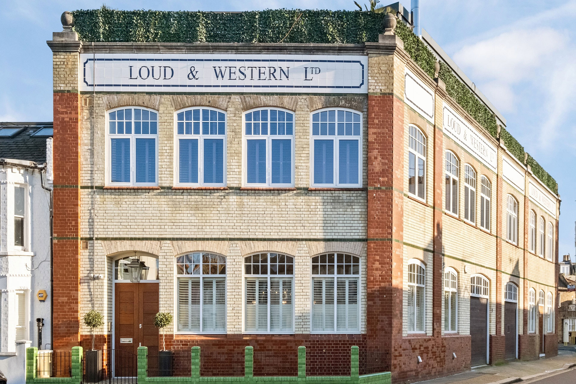 Former Victorian laundry factory with 'Loud & Western' logo on the facade