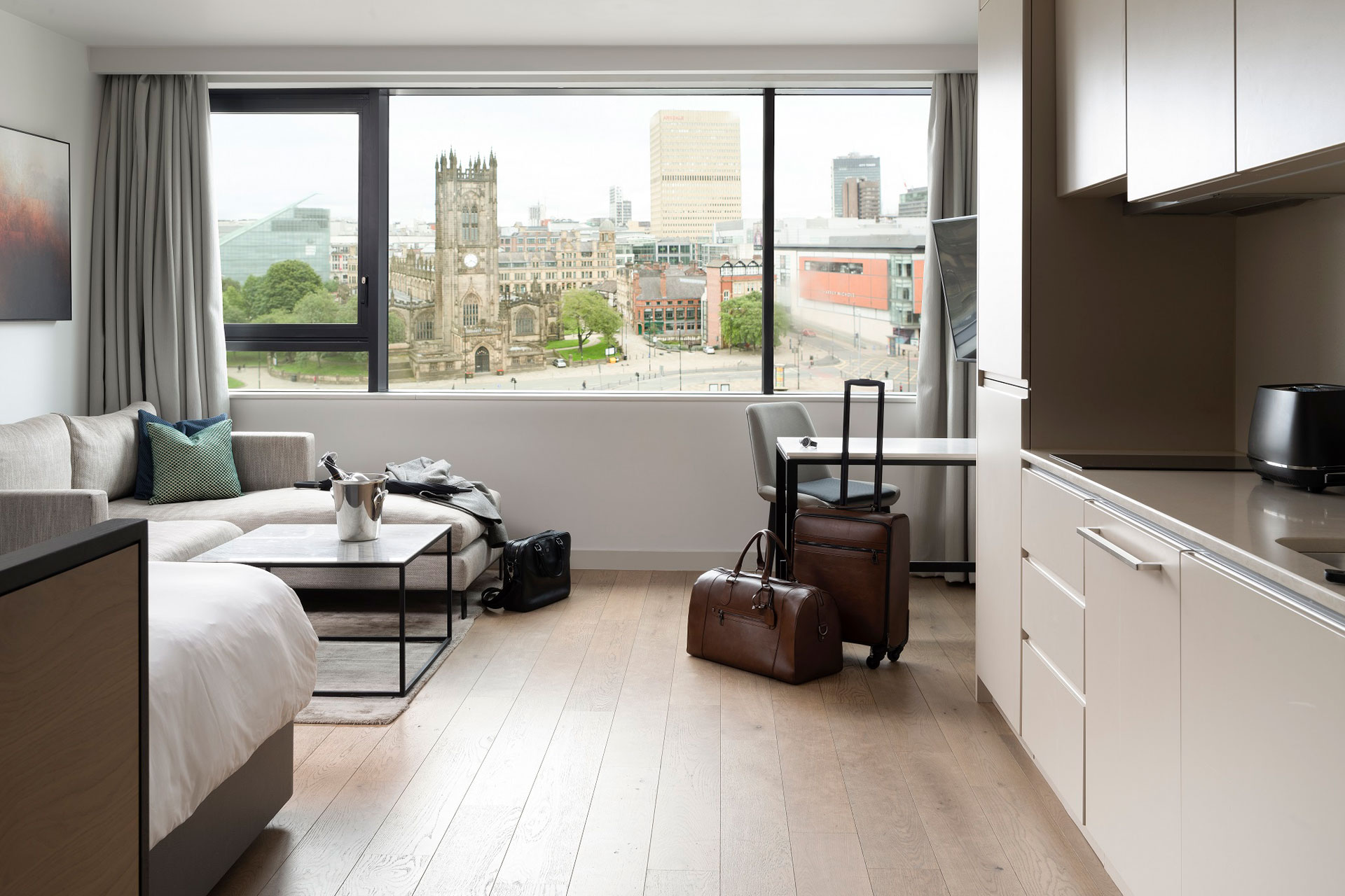 Studio ApartHotel with sofa area, kitchen and views of Manchester city centre.