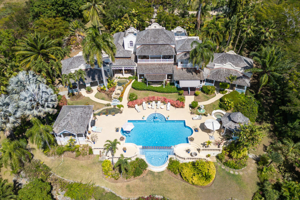 Aerial view of Barbados mansion, with outdoor pool, terrace and gardens.