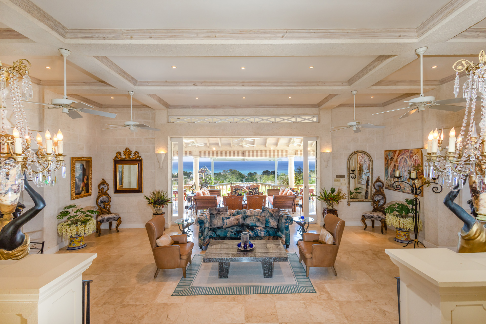 Entrance hall of Barbados villa, with marble floors, high ceilings and views of the Caribbean Sea.