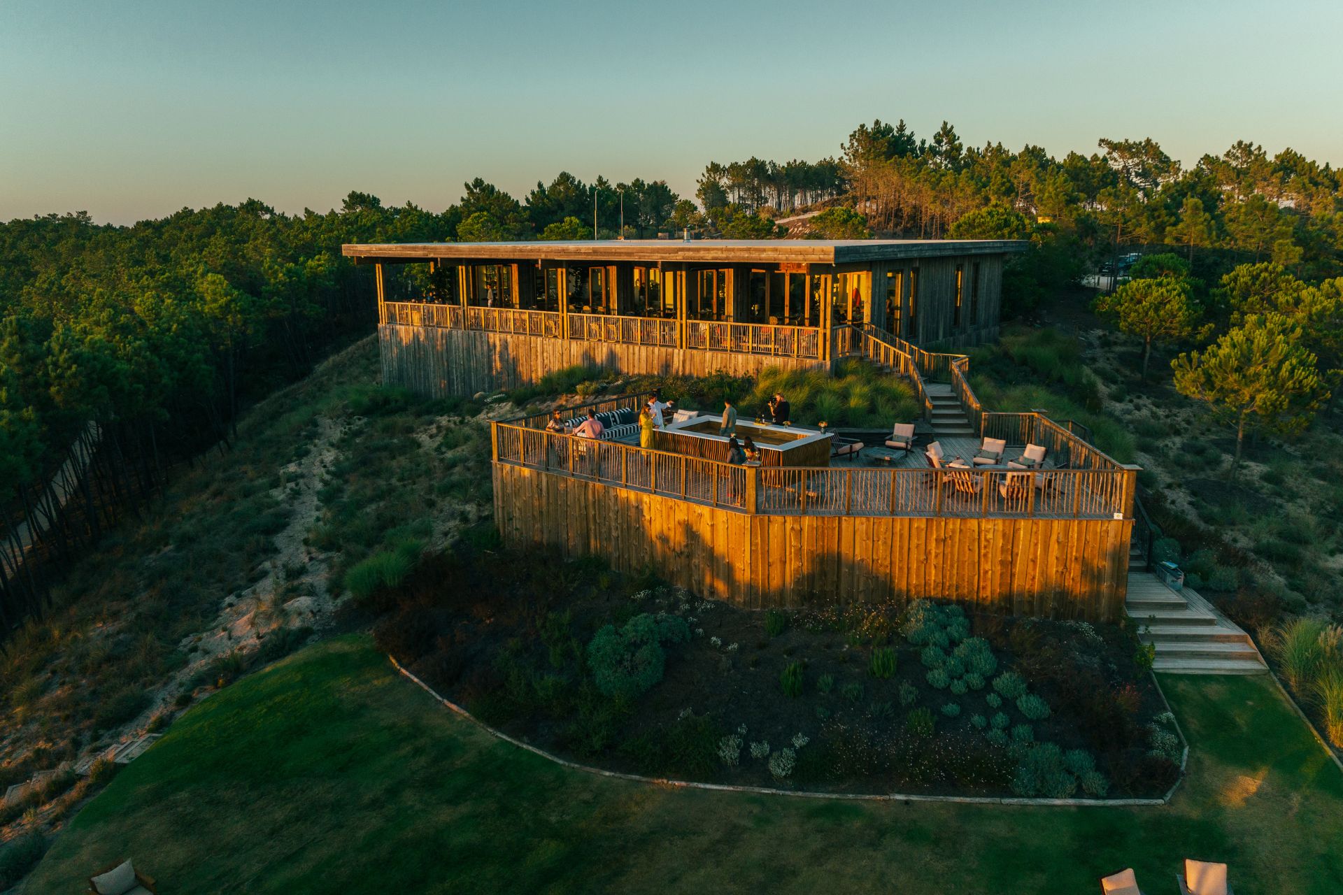 Aerial view of wood-panelled residents' lounge on a hill in Portugal.