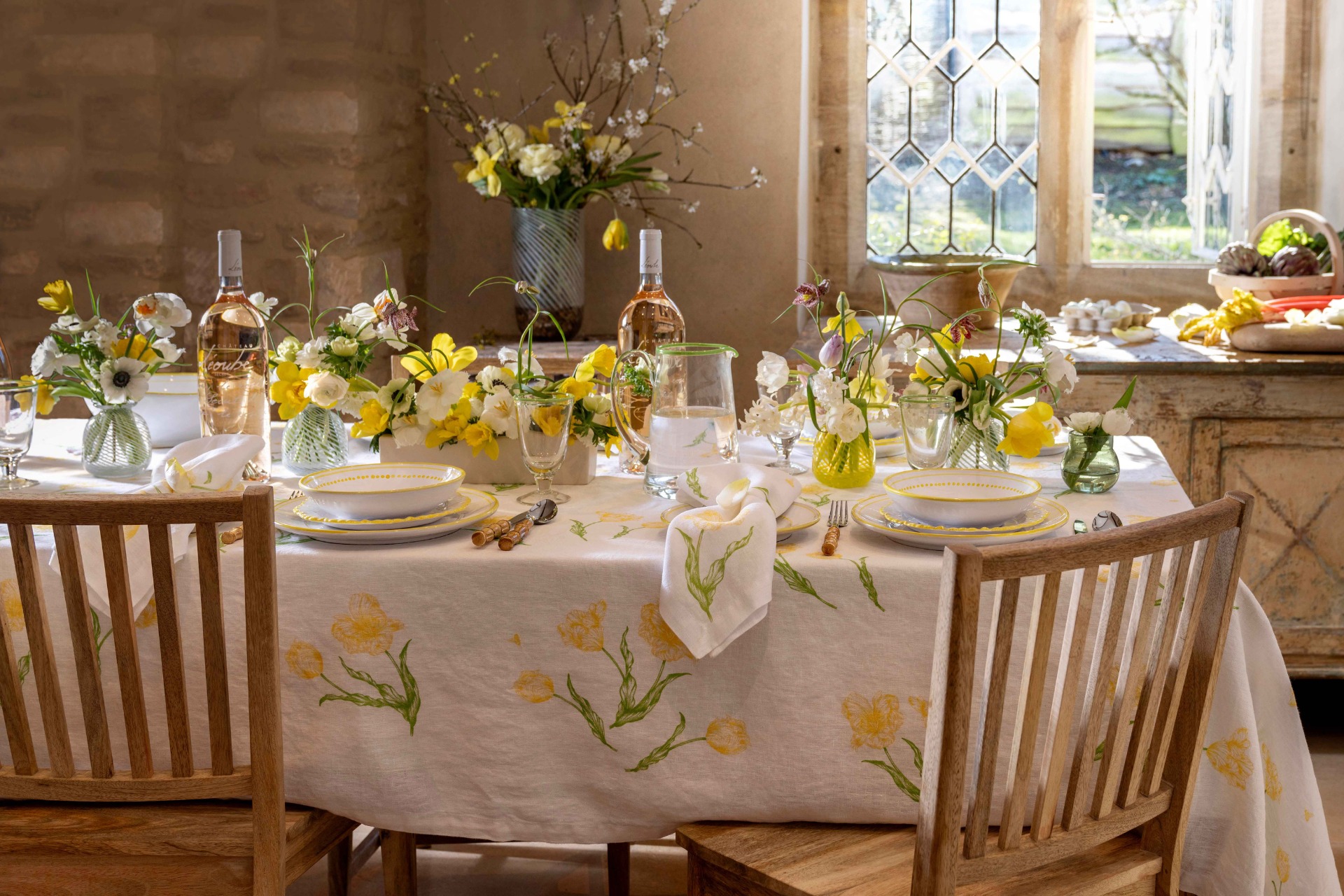 Table laid with yellow flowers