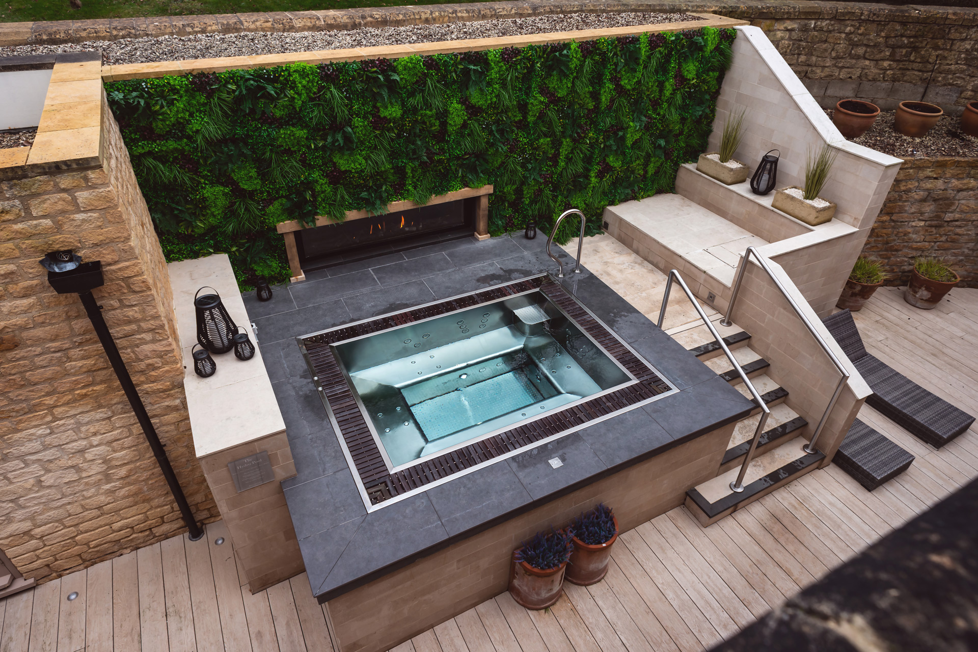 Outdoor hydropool with green wall.