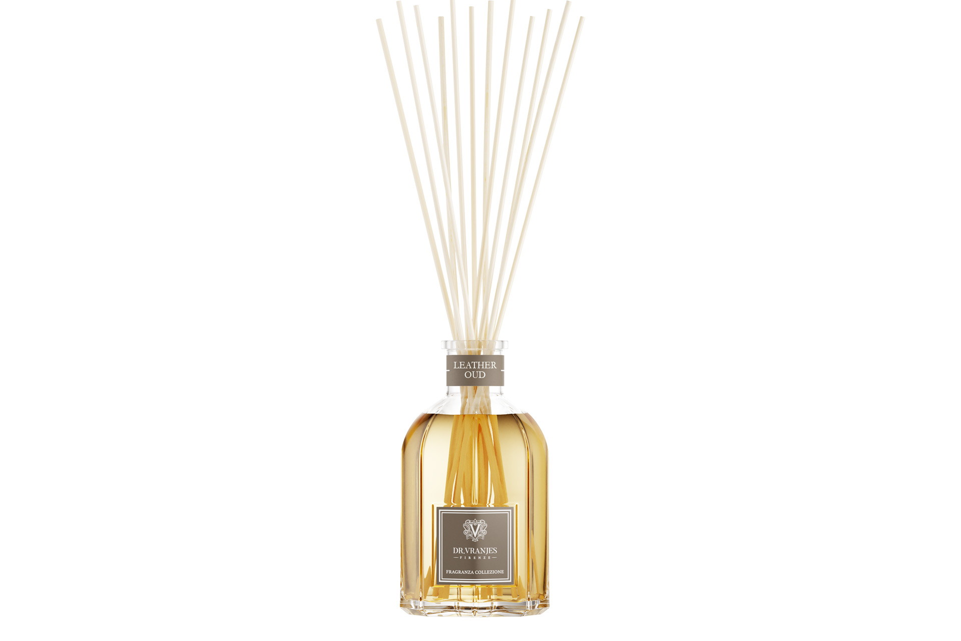 Glass diffuser with gold liquid and white sticks