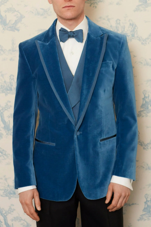 Man in blue velvet suit jacket