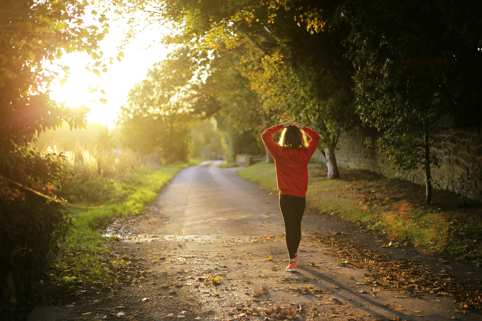 Woman stopping her run on a country path