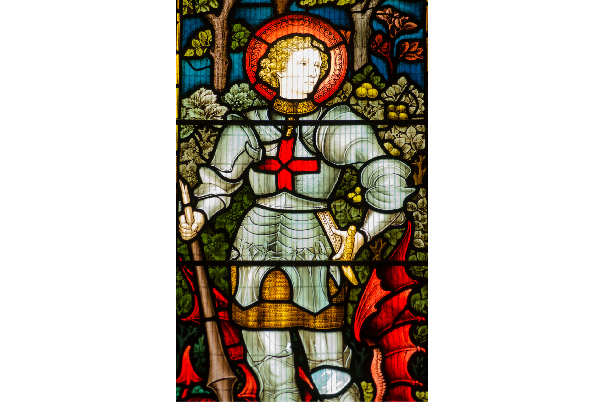 Victorian stained glass window showing Saint George with his defeated dragon.