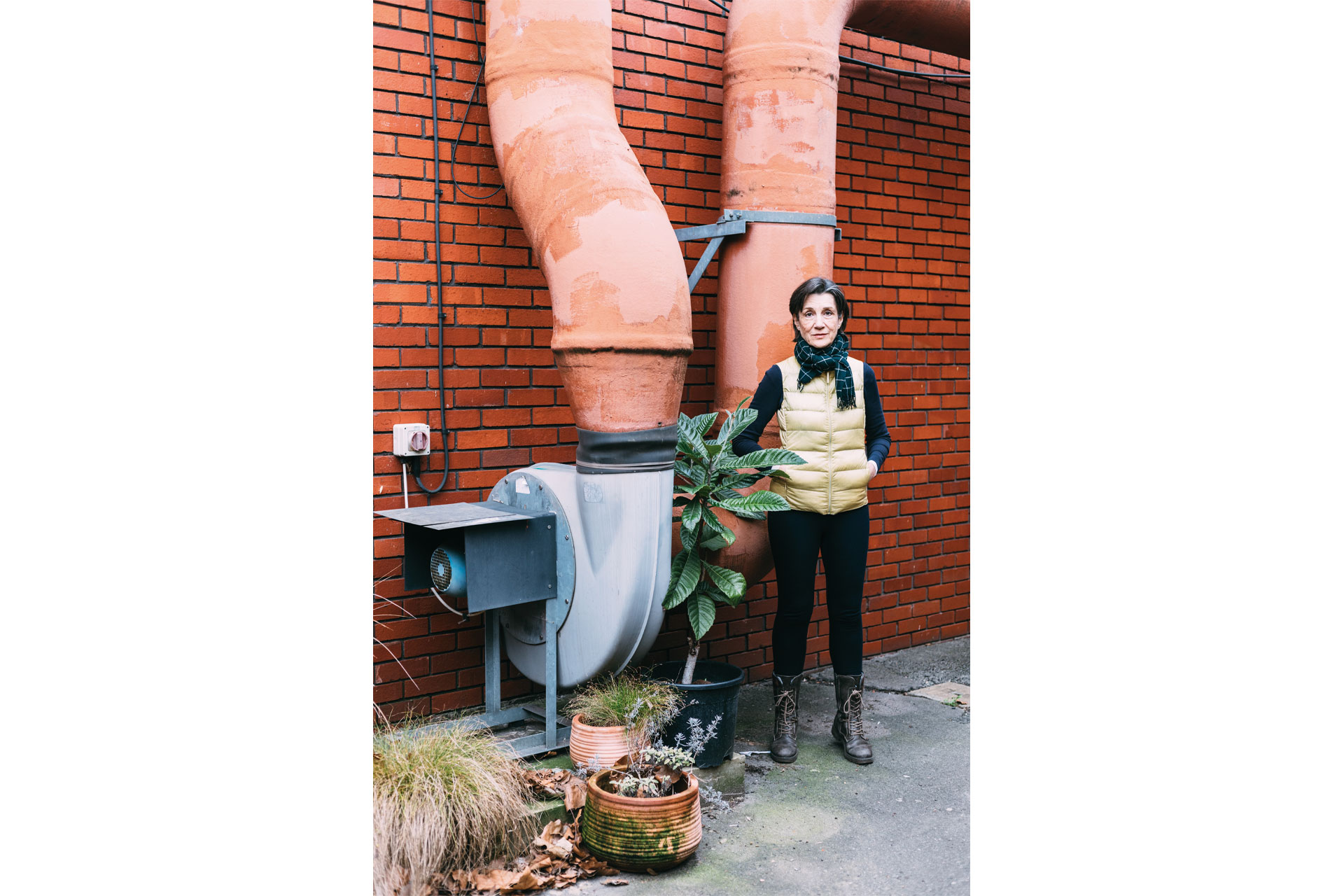 Harriet Walter stood in front of brick wall