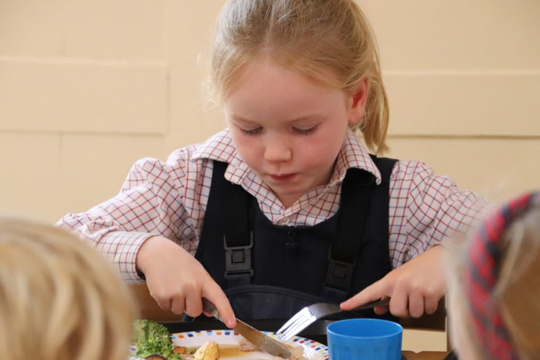 Student eating at lunch time
