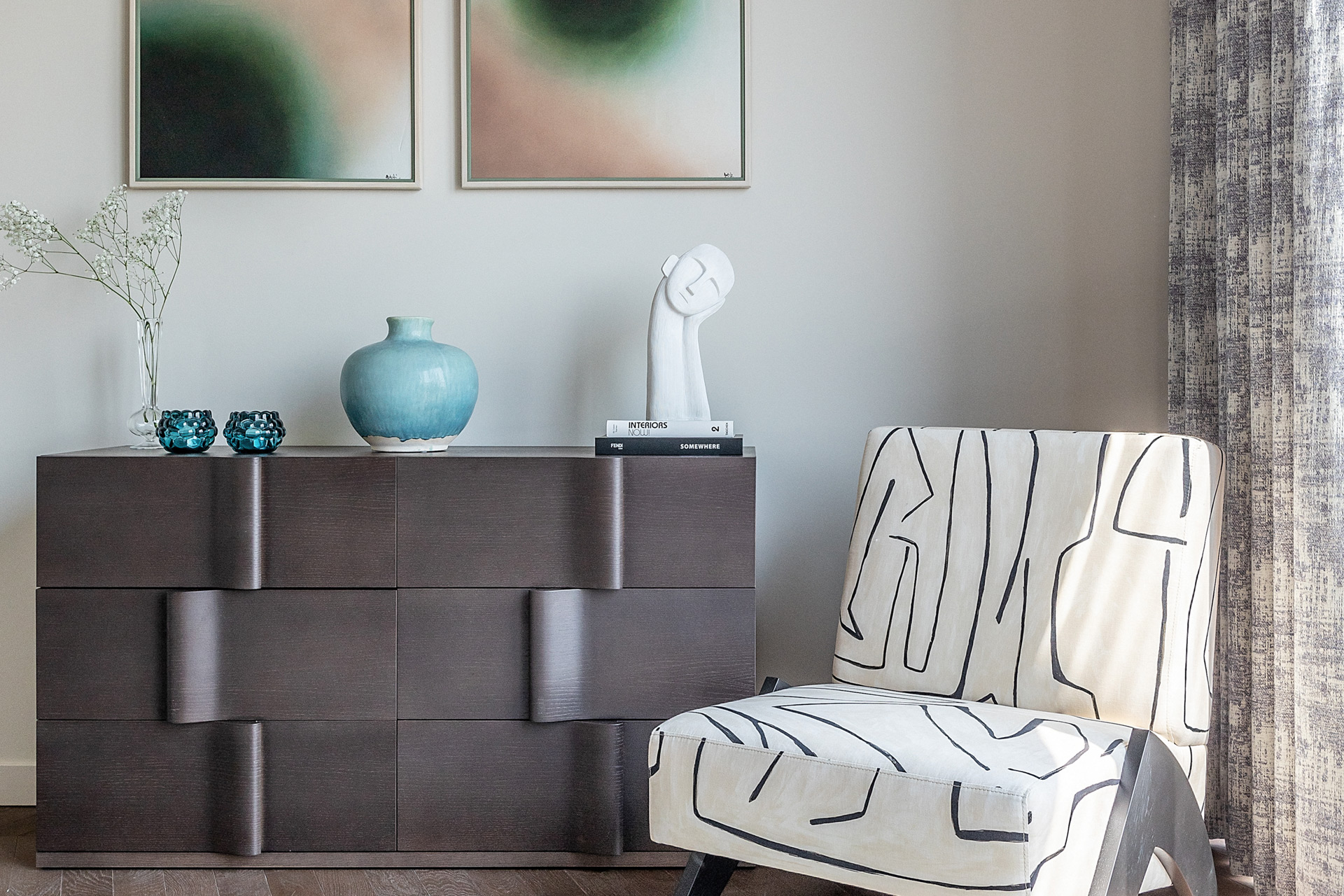 Dark oak chest of drawers in a wave-like design