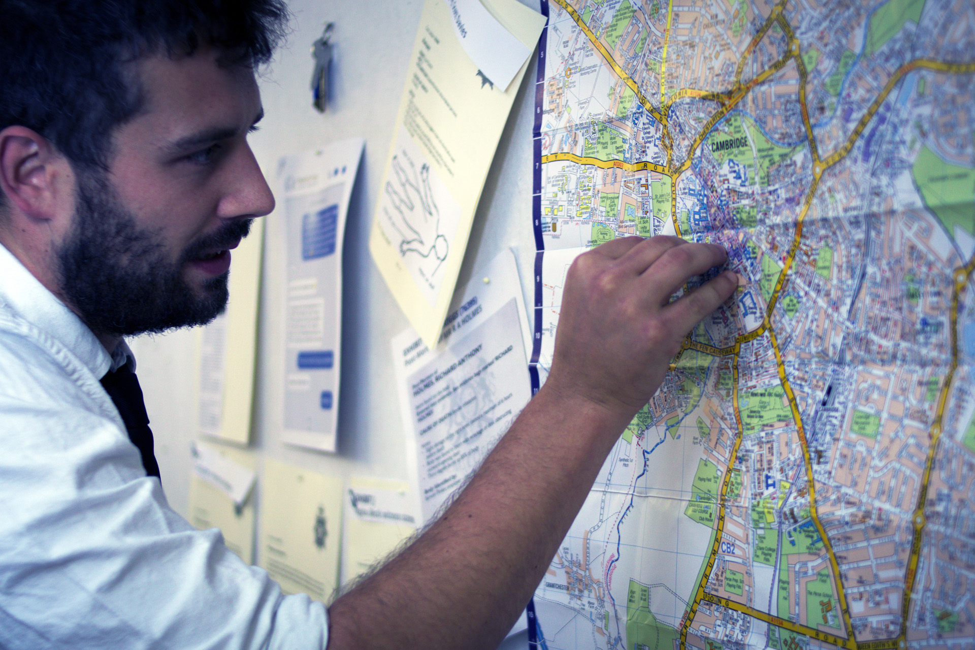 A man pinning on a map