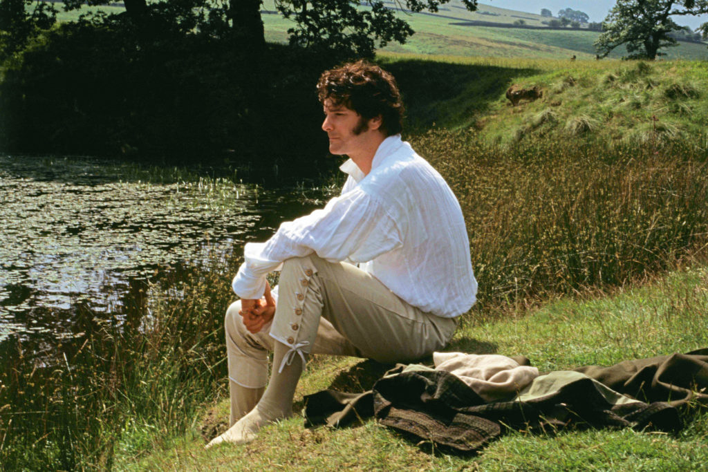 Colin Firth as Fitzwilliam Darcy sitting by the lake in the six-part BBC adaptation of the Jane Austen novel 'Pride and Prejudice', 1995.