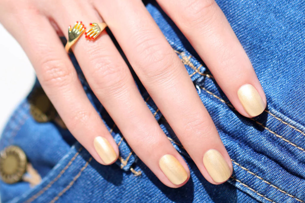 Hand with golden nails