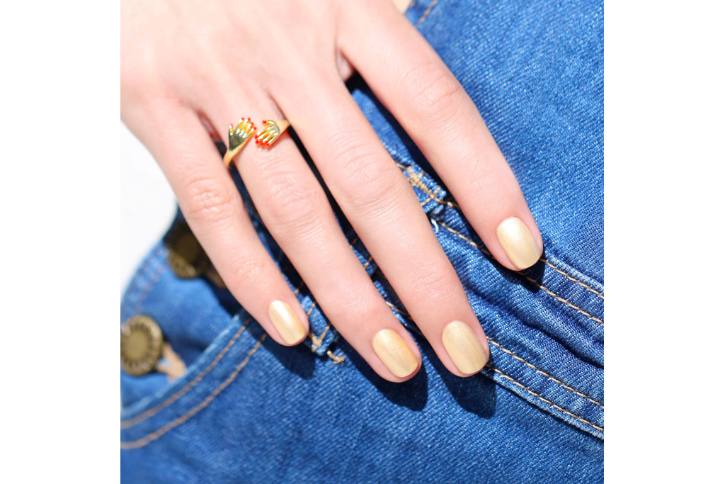 Hand with golden nails