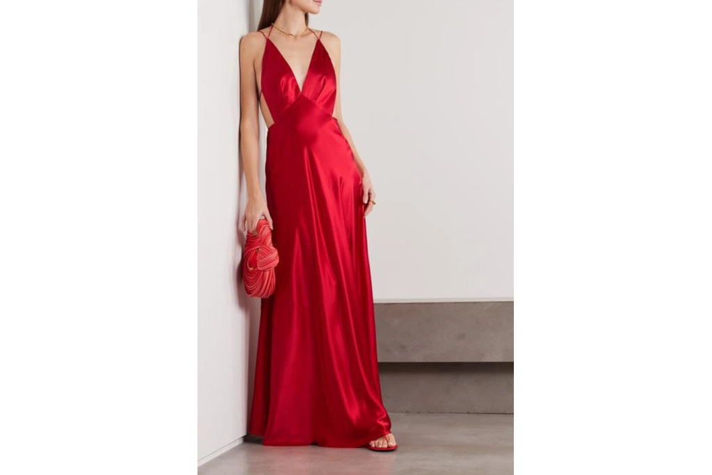 Woman in red black tie wedding guest dress