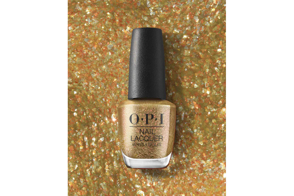 Gold nail varnish on gold glitter background