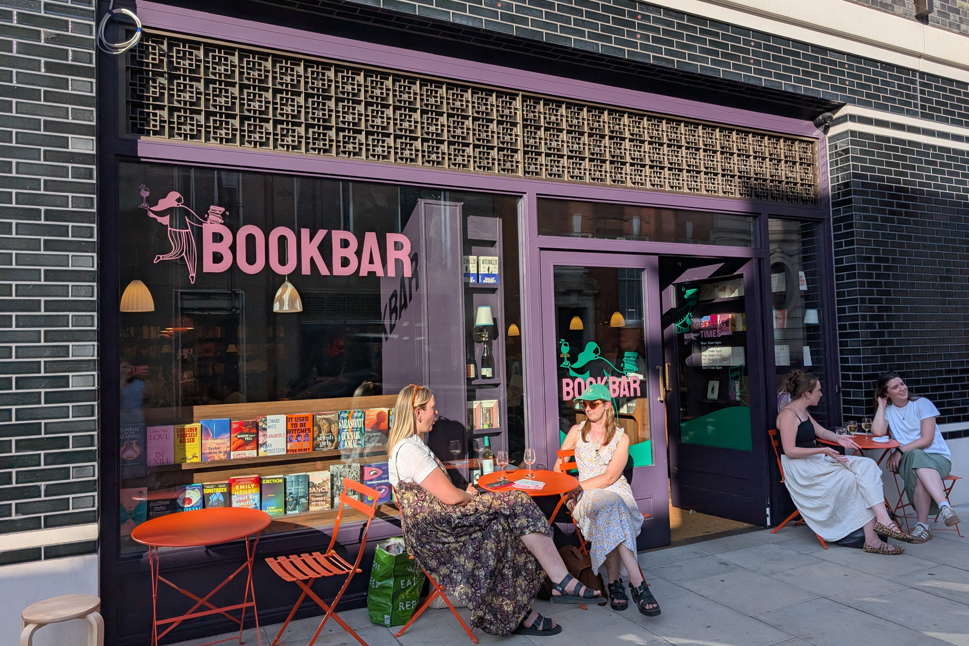 People sitting outside BookBar Chelsea