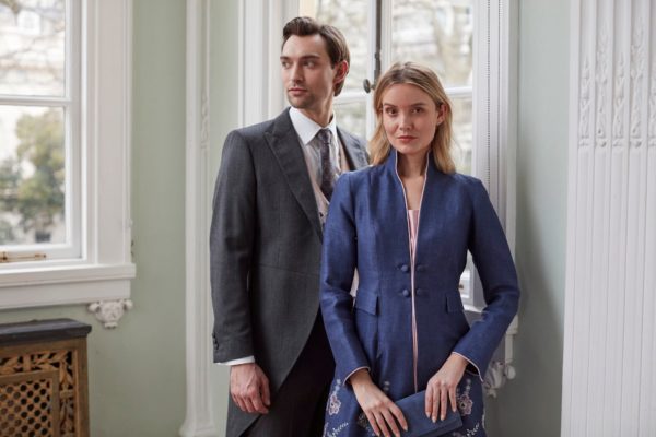 Man and woman wearing Favourbrook clothes in front of window