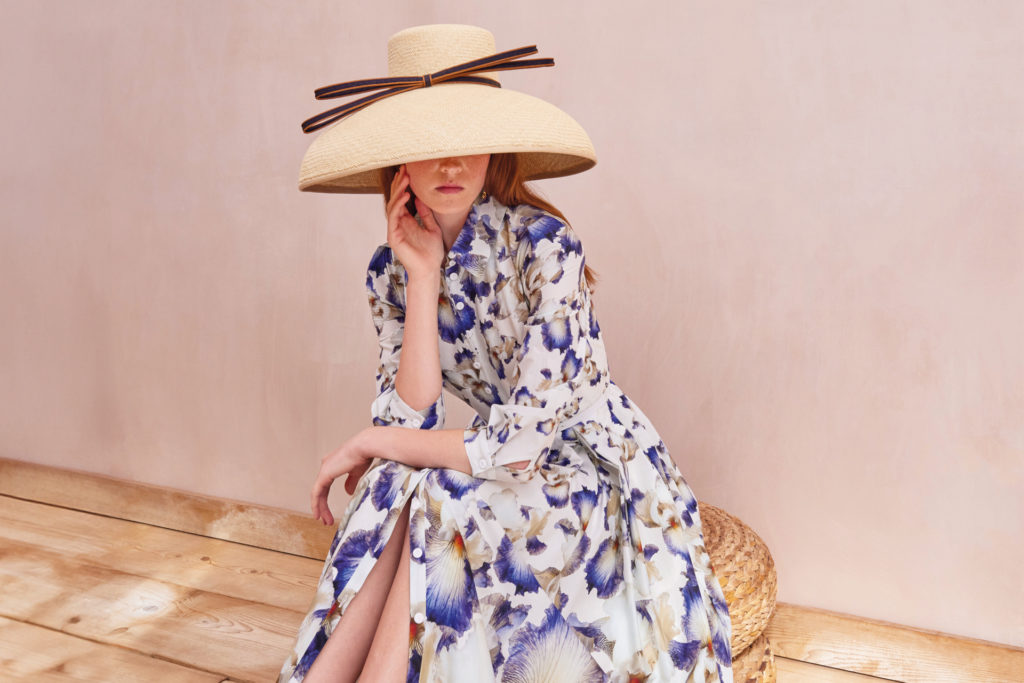 Woman in floral dress and hat