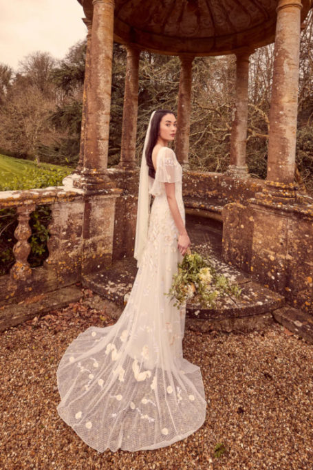Woman stood out doors in wedding dress