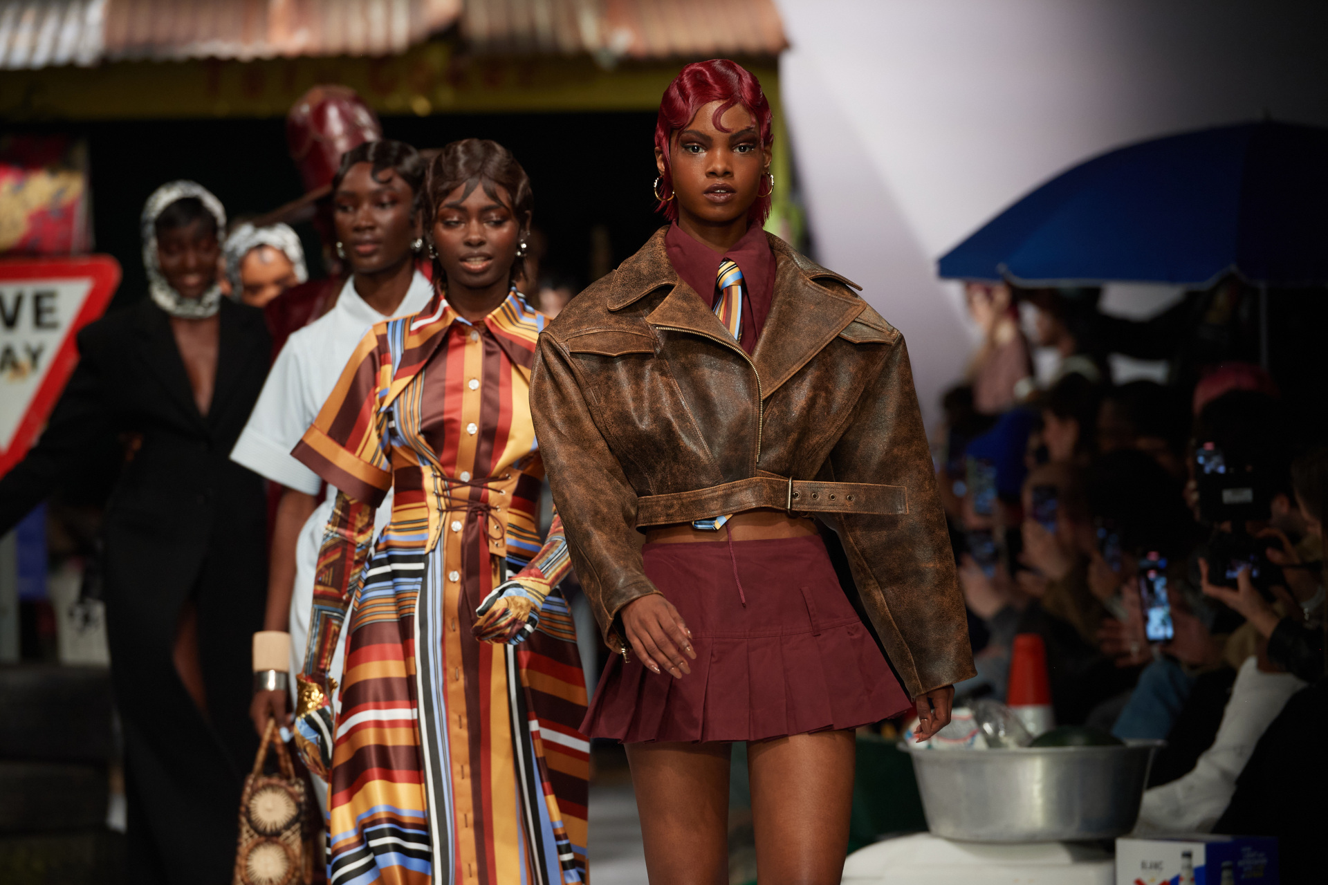 Models walking on runway in one line