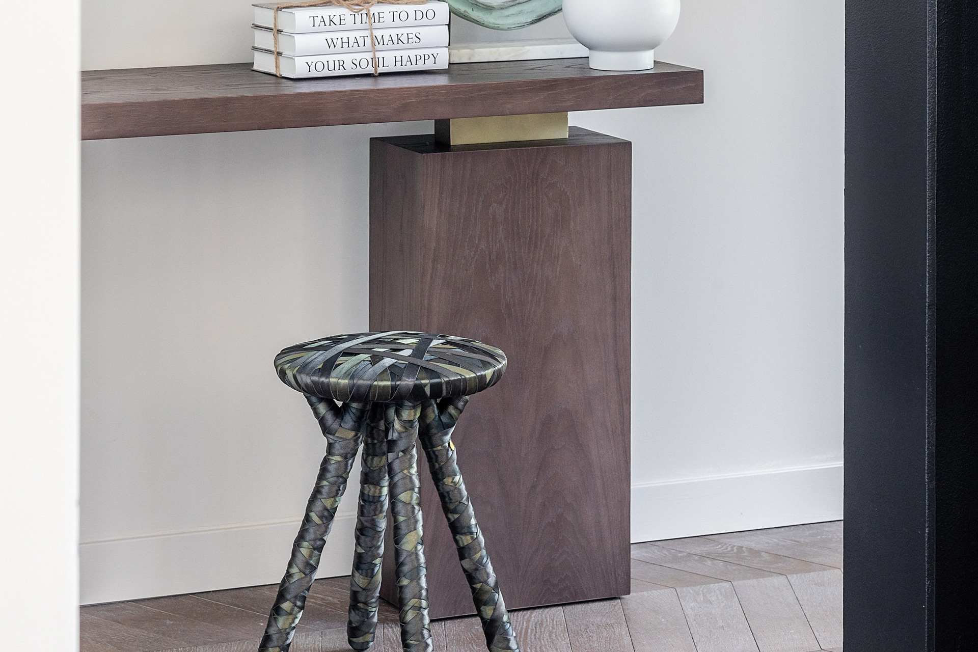 Black stool made from repurposed lingerie