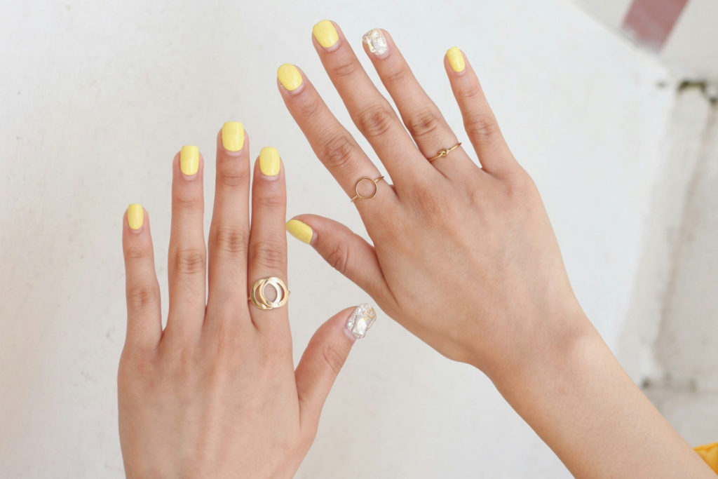 Pastel yellow manicure with silver accents