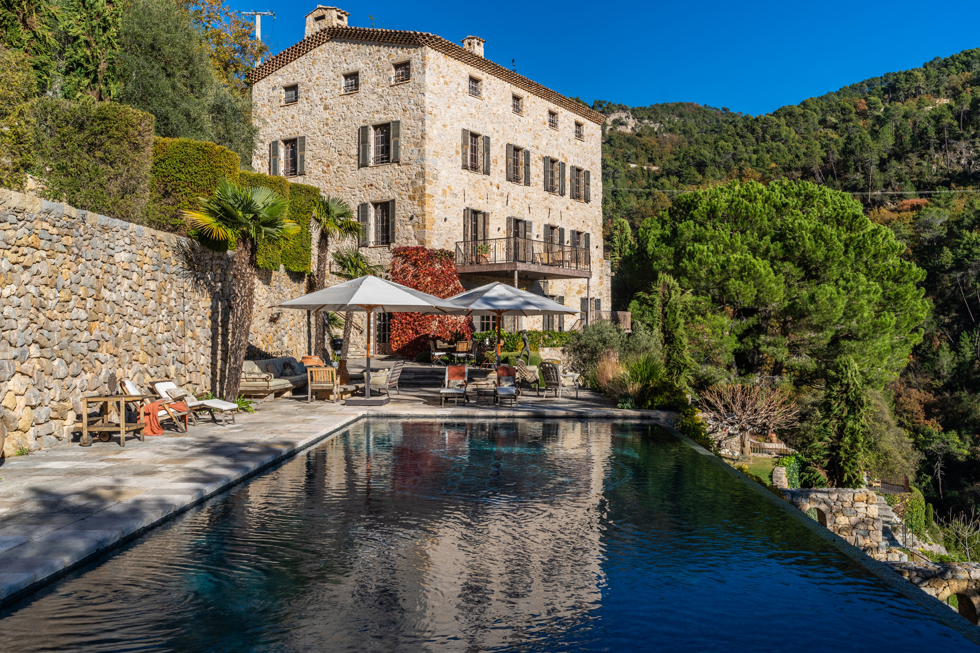 Converted mill with swimming pool and view of surrounding hils.