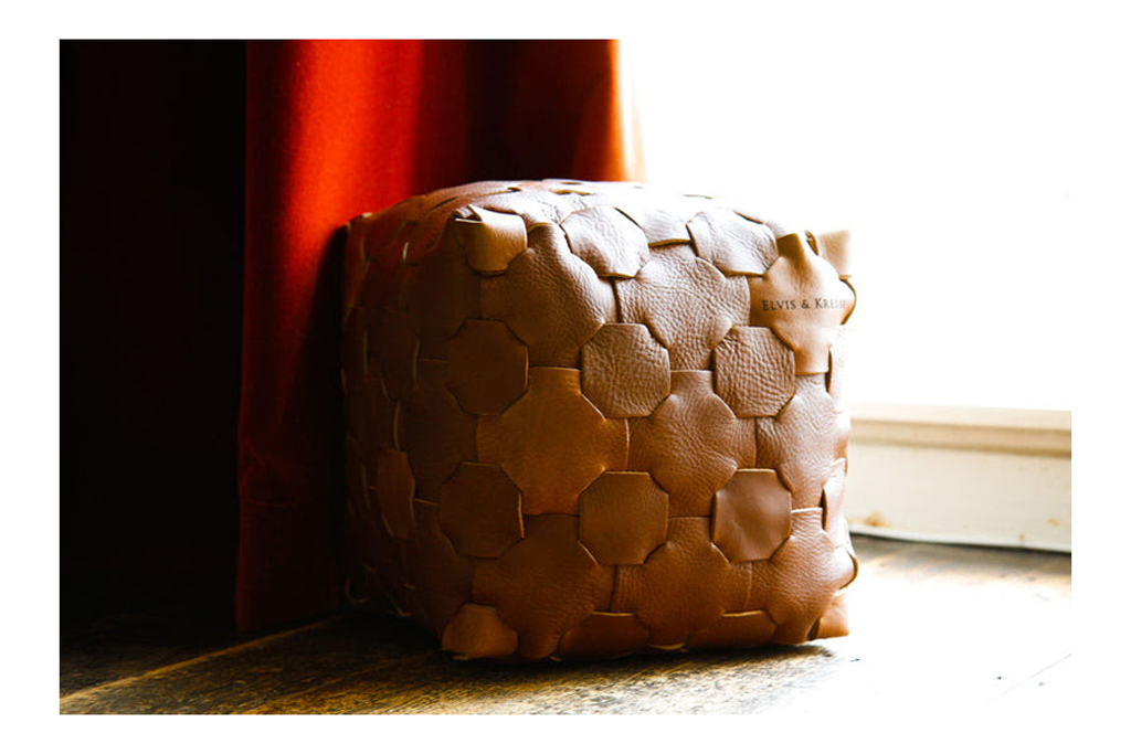 A brown leather pouffe