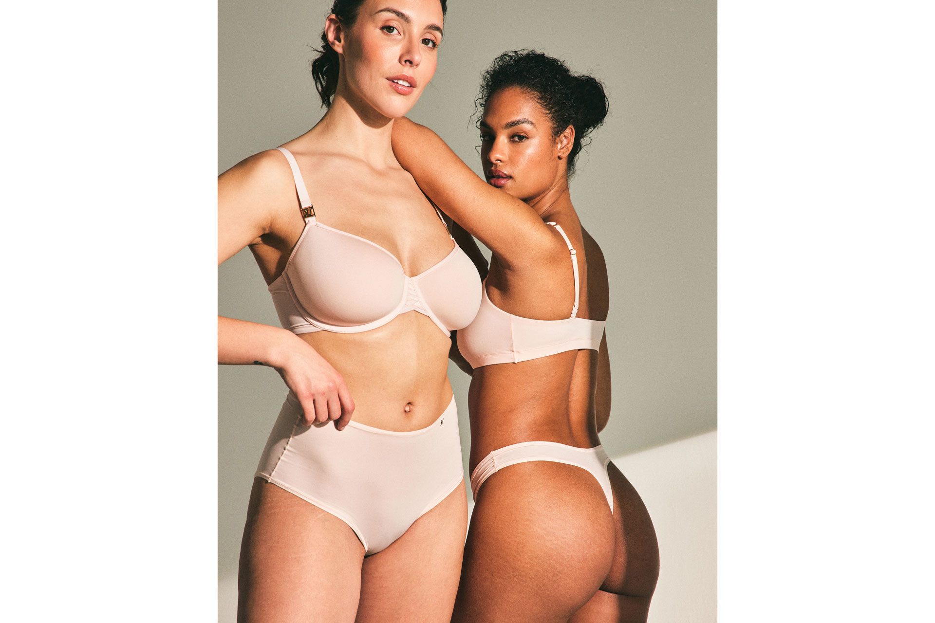Nude shapewear modelled by two women