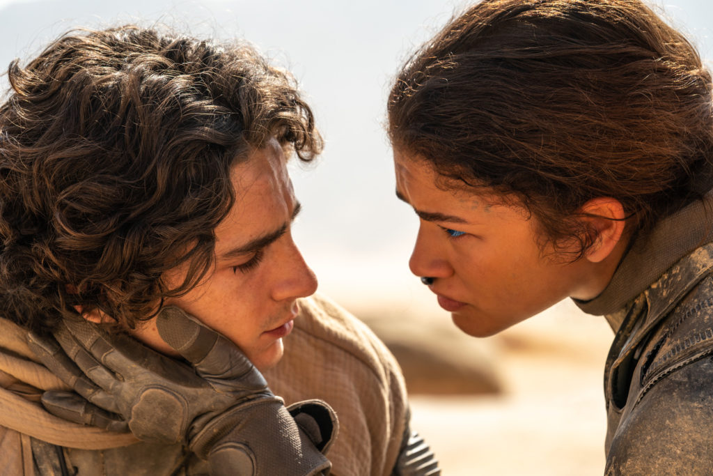 TIMOTHÉE CHALAMET as Paul Atreides and ZENDAYA as Chani in Warner Bros. Pictures and Legendary Pictures’ action adventure “DUNE: PART TWO”, one of our top film recommendations
