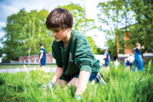 Shrewsbury School pupil gardening 