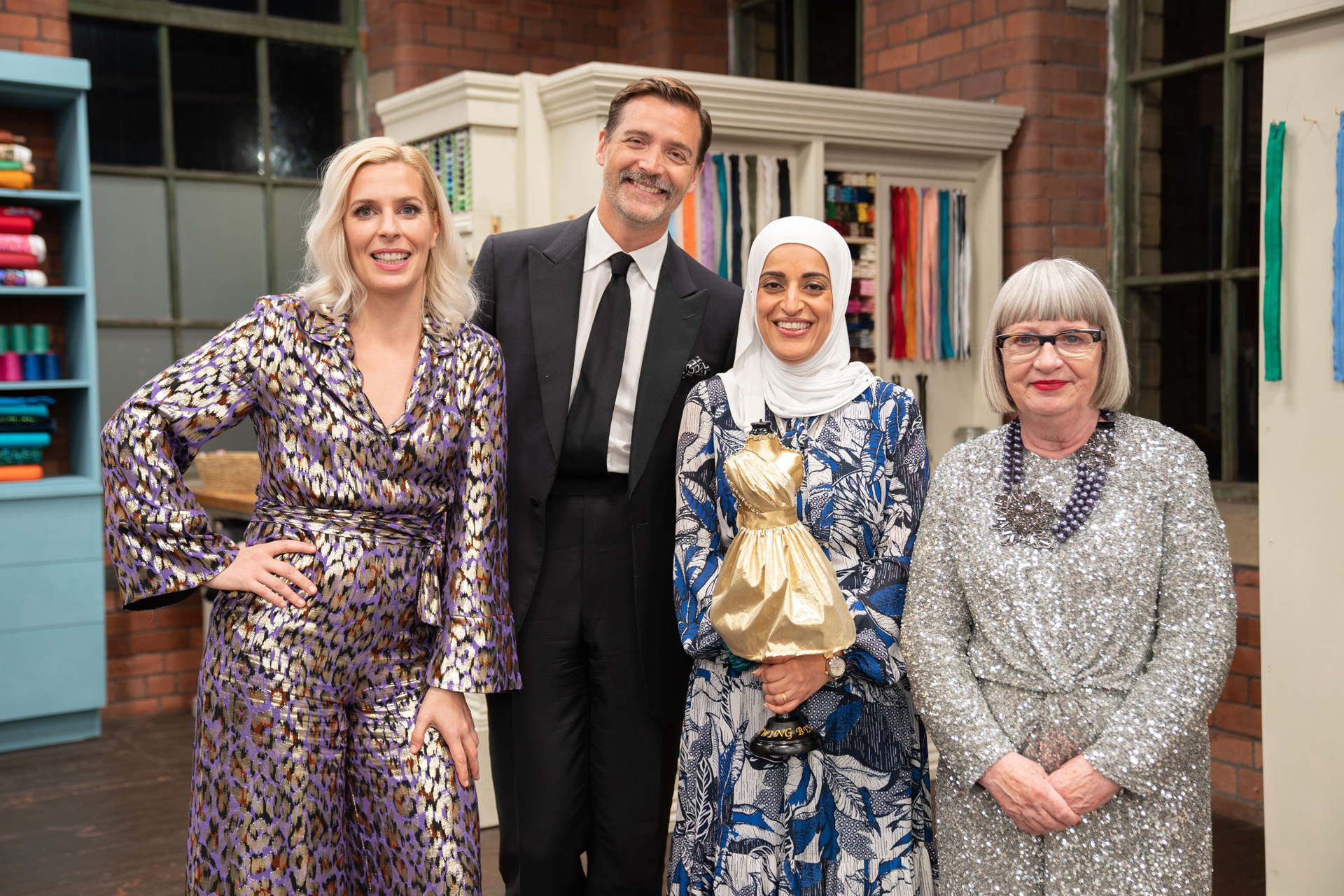 Presenter Sara Pascoe, Judges Patrick Grant and Esme Young with sewer Asmaa, with sewer Asmaa, Winner of The Great British Sewing Bee S9