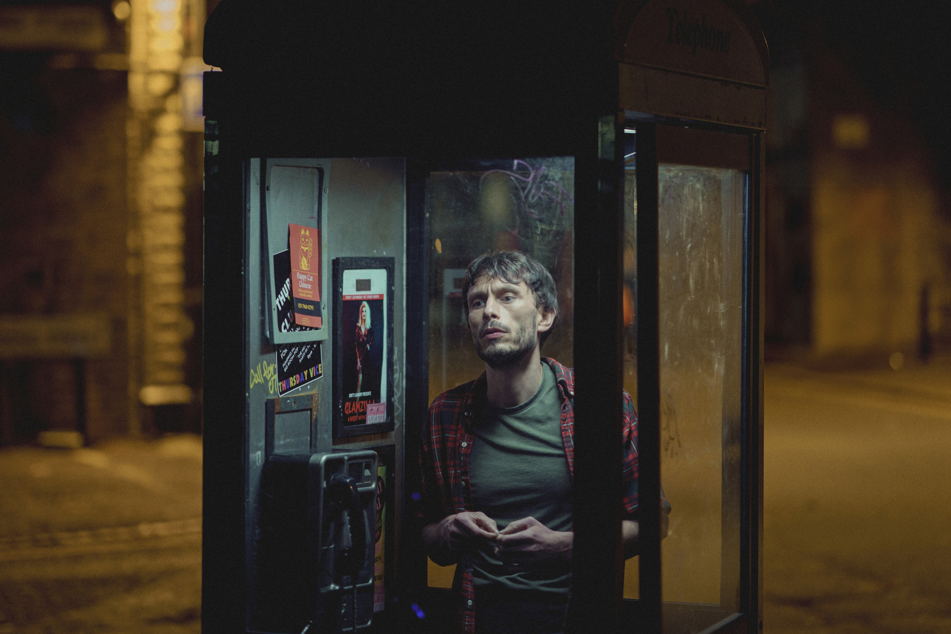 A man in a phone box