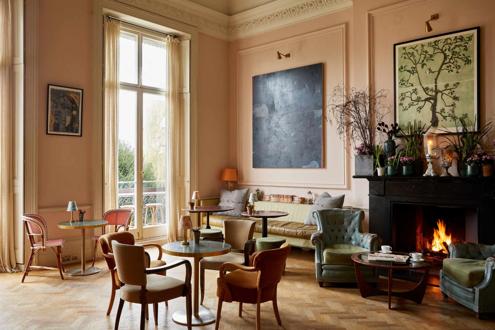 Bingham Riverhouse Drawing room Bar with parquet flooring, pink walls and a fireplace.