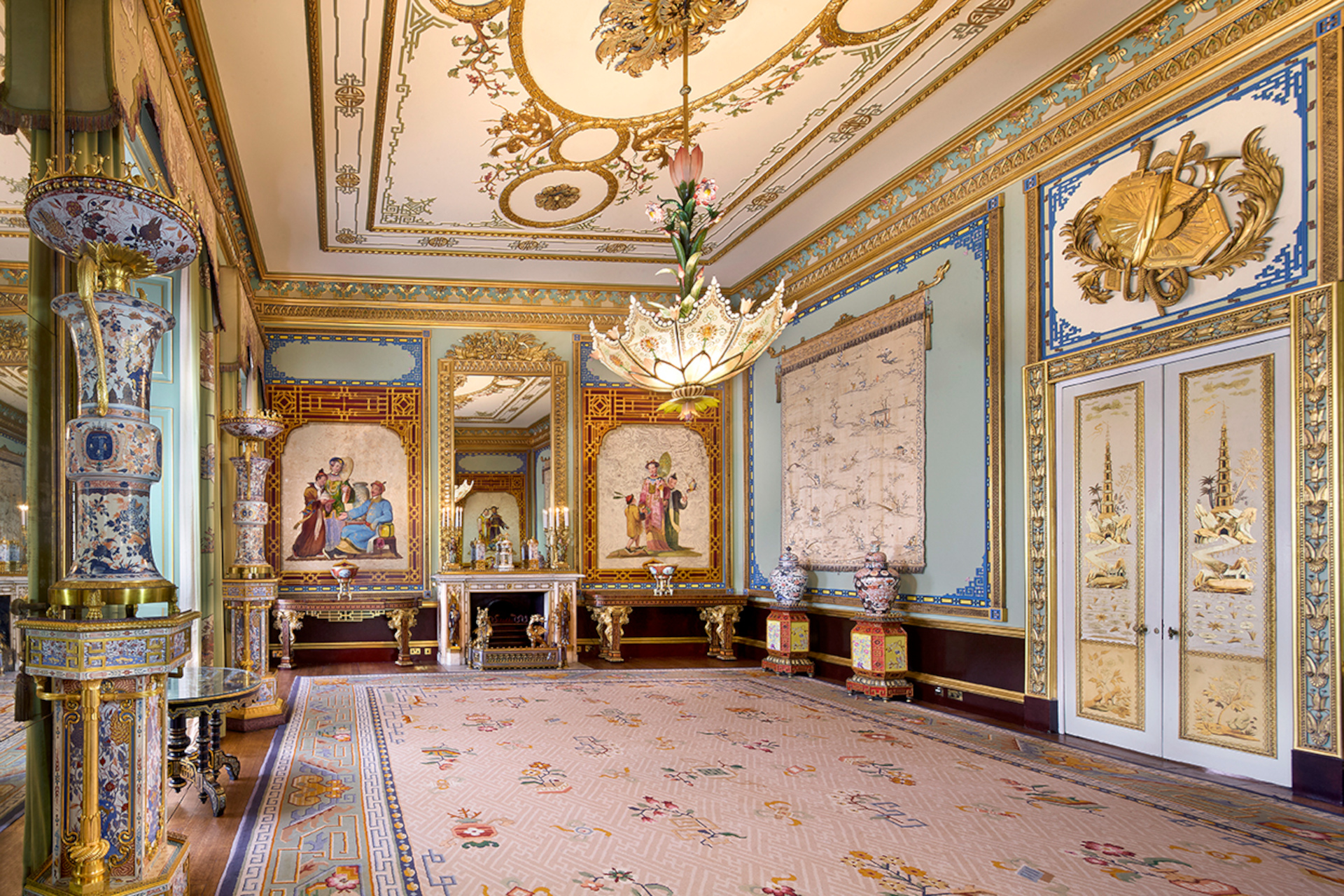 Ornately decorated room with gold ceilings and chandelier