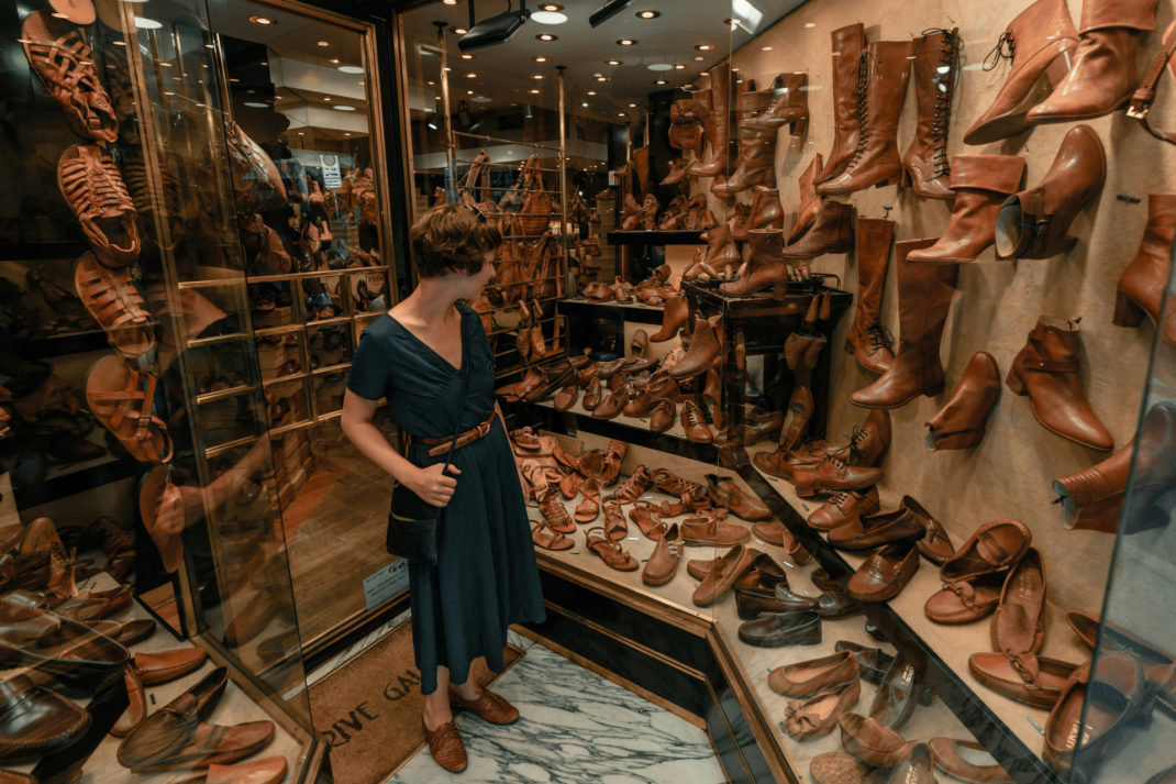 Woman in leather shoe shop