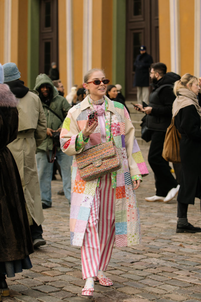 Woman in quilted patchwork jacket
