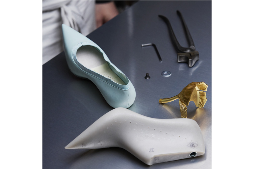 A craft person making a shoe